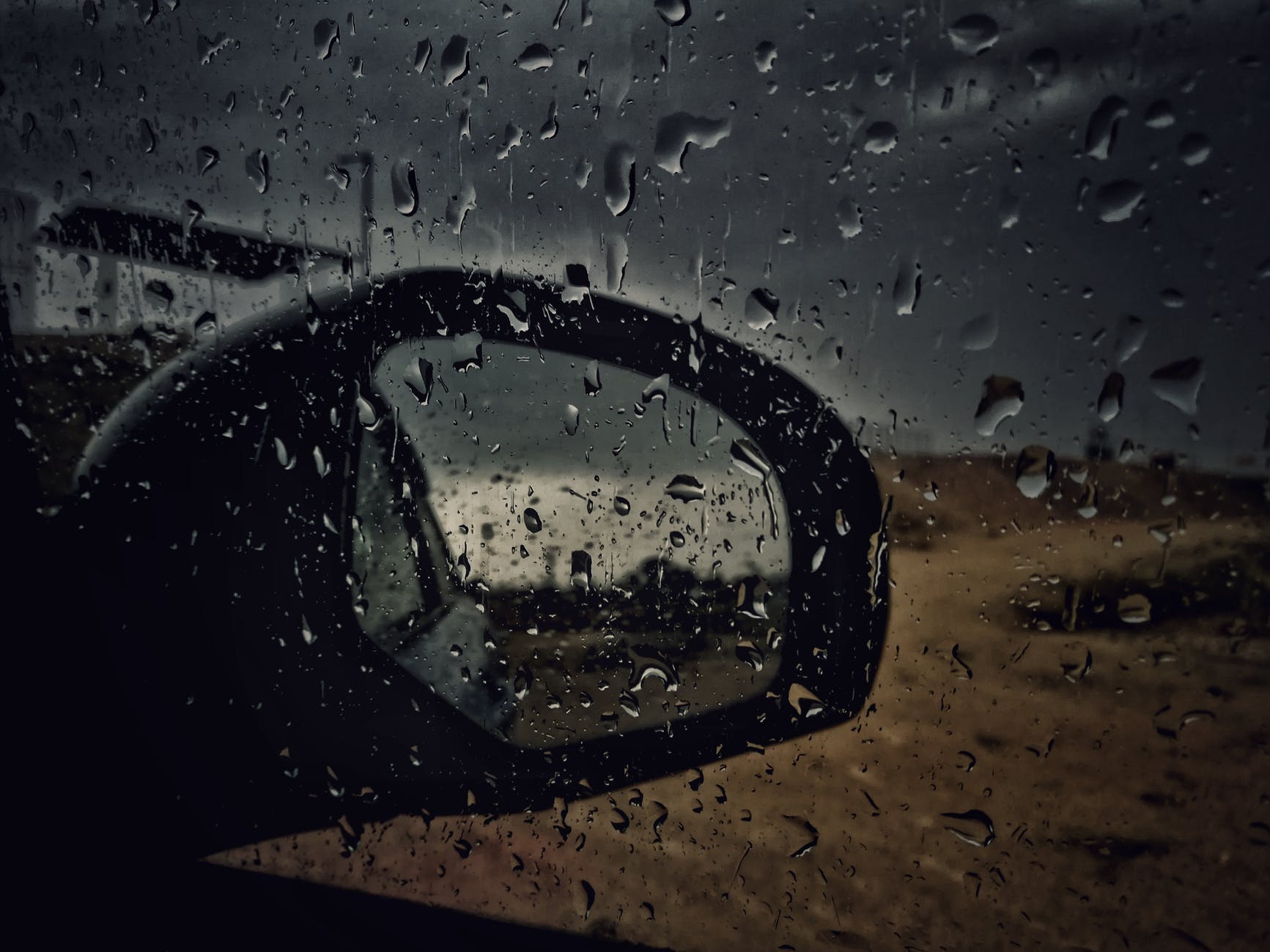 car window panel with water droplets